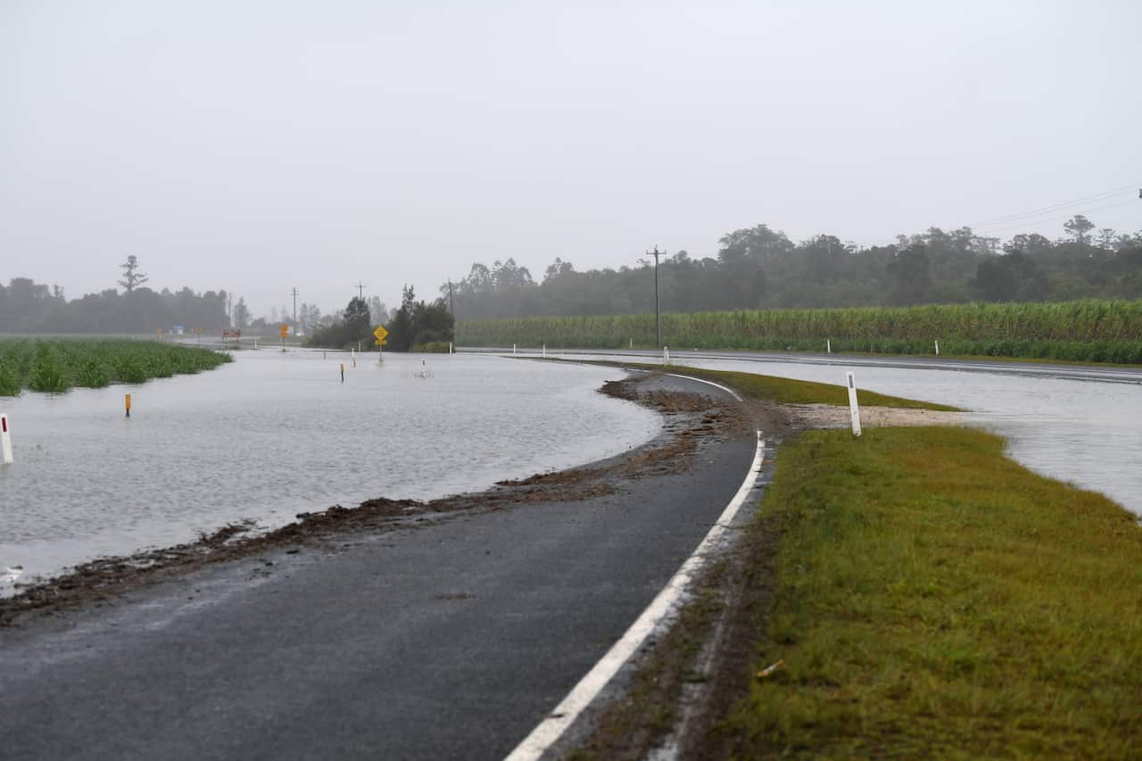 A flooded road at Tumbulgum, NSW, Monday, 14 December, 2020. 