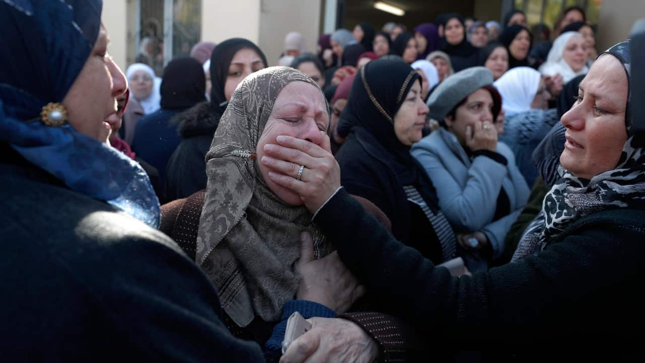 Mourners attend the funeral of Aya Maasarwe at her hometown of Baqa al-Gharbiya.