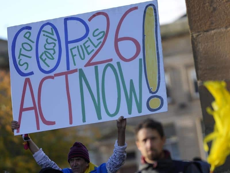 Activists participate in a climate change protest in Glasgow