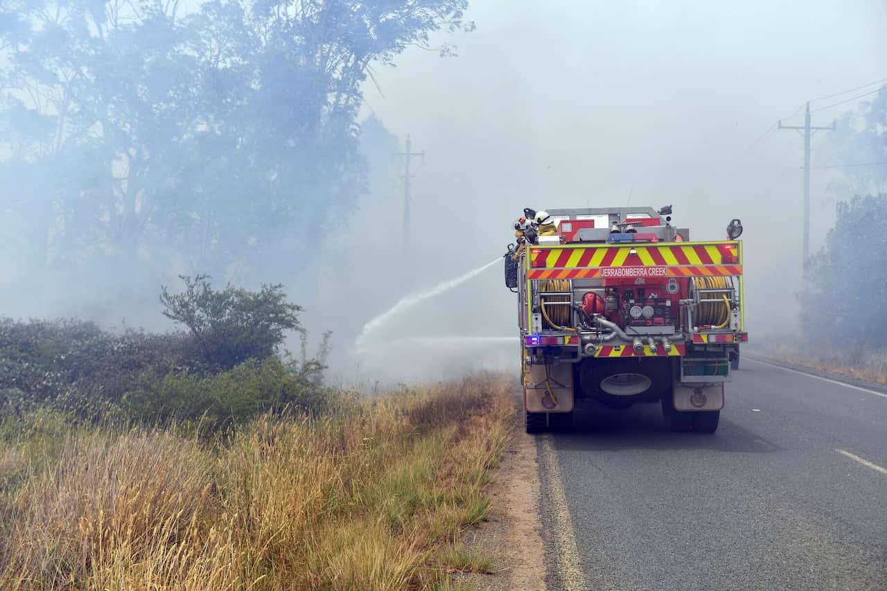Firefighters battle a blaze near Canberra