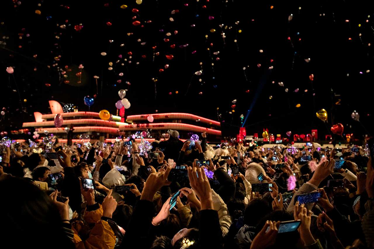 Revellers took to the streets to celebrate New Year's Eve in Wuhan, China.