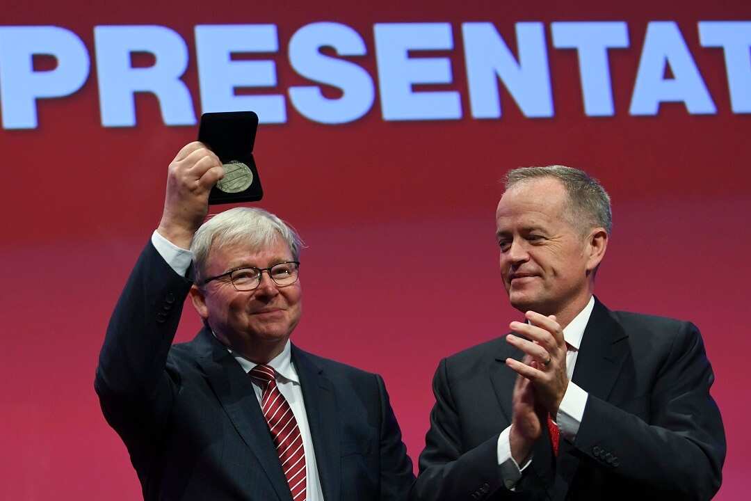Former Prime Minister Kevin Rudd (left) is congratulated by Opposition Leader Bill Shorten.