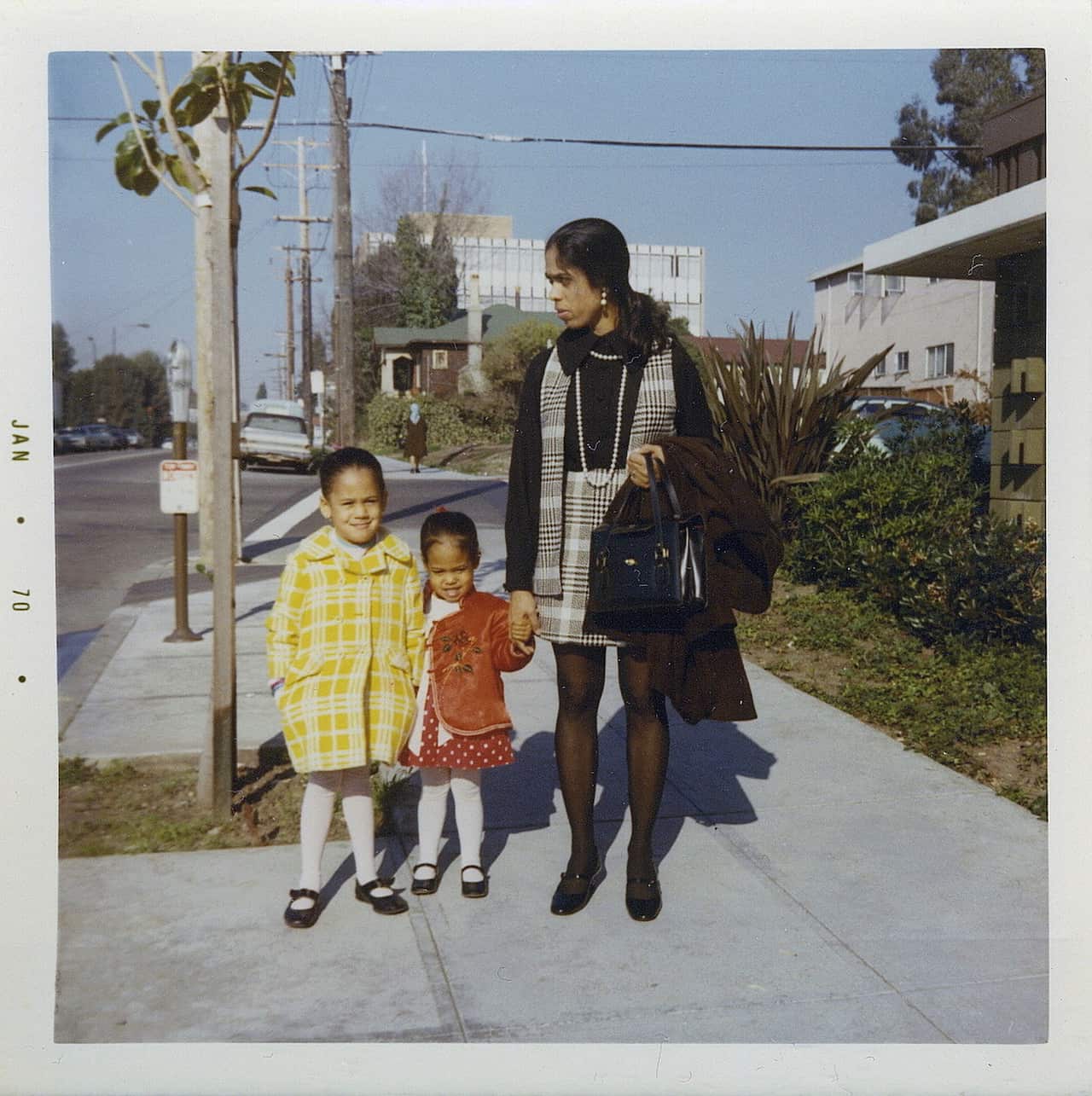 Ms Harris, left, with her sister, Maya, and mother, Shyamala, outside their apartment in Berkeley in 1970. 