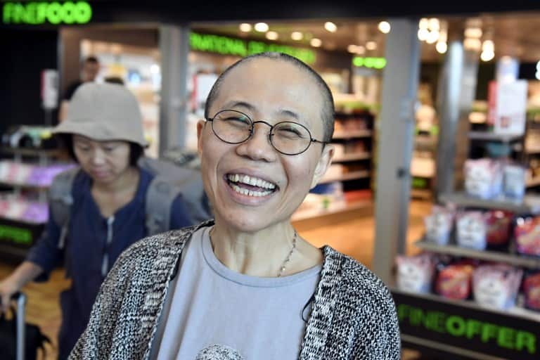 Liu Xia, the widow of Chinese Nobel dissident Liu Xiaobo, smiles as she arrives at the Helsinki International Airport in Vantaa, Finland, on July 10, 2018. Despite facing no charges, the 57-year-old poet had endured heavy restrictions on her movements sin