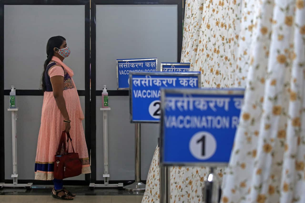 A woman waits to receive a COVID-19 vaccine shot at Shatabdi Hospital in Mumbai, India on 30 January.