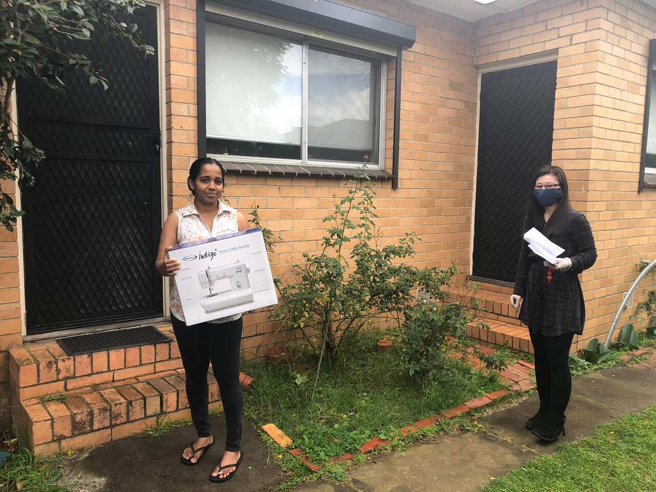 SisterWorks staff drop off supplies to the sewers at home and collect the finish masks so they can comply with Stay at Home restrictions. 