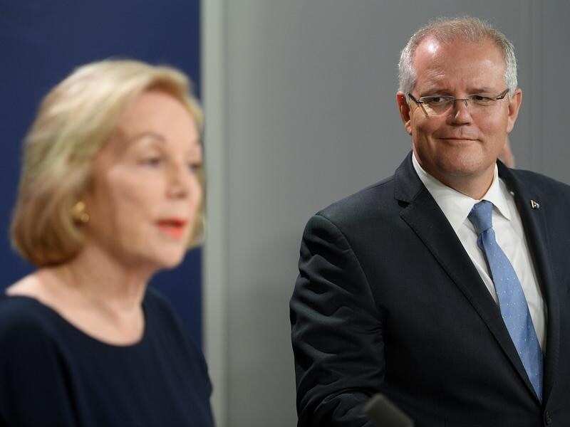 ABC Chair Ita Buttrose (L) and Prime Minister Scott Morrison are expected to meet soon. The ABC boss is now considering legal action. 