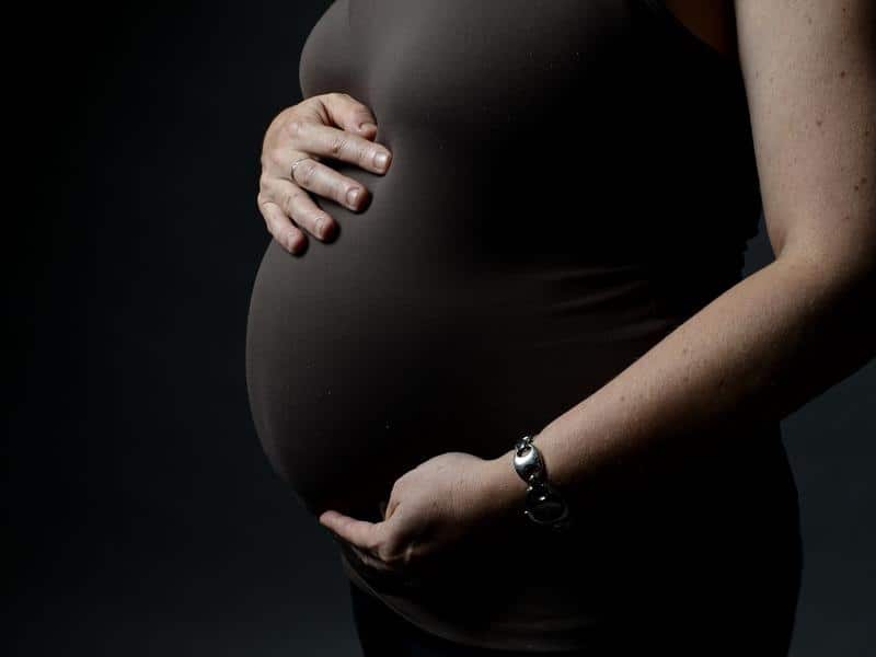 A pregnant woman.