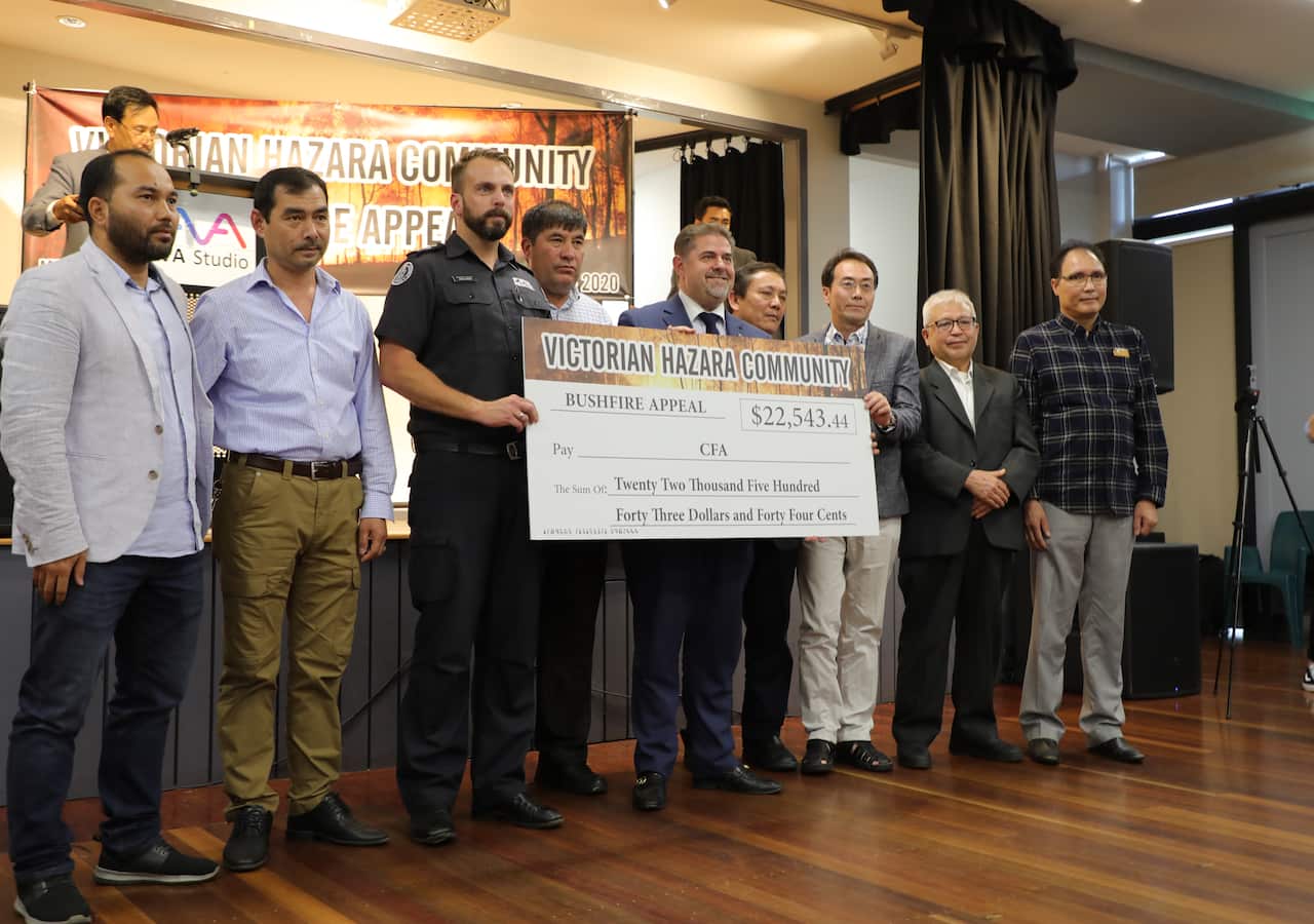 Community leaders and businessmen presented $22,543 of the fund to the CFA 