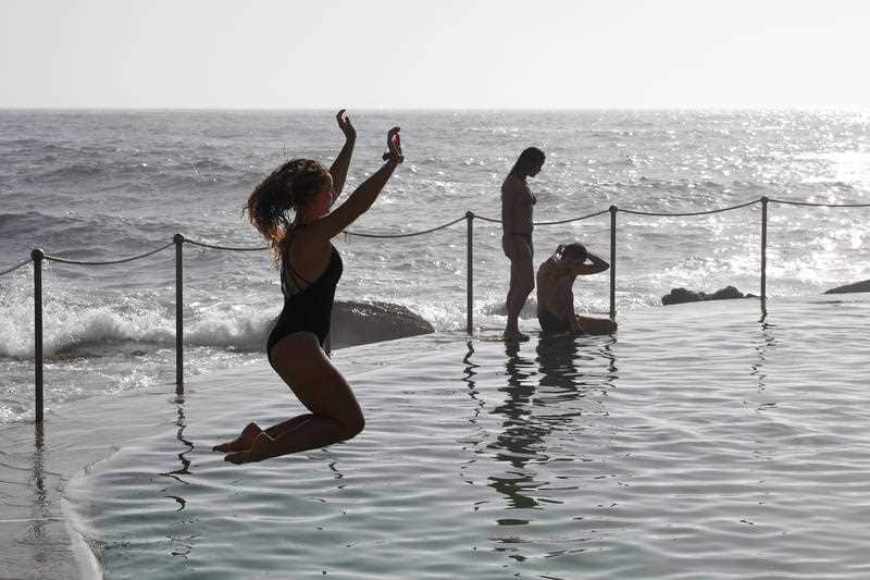 Beachgoers cool off at Bronte Beach in Sydney.