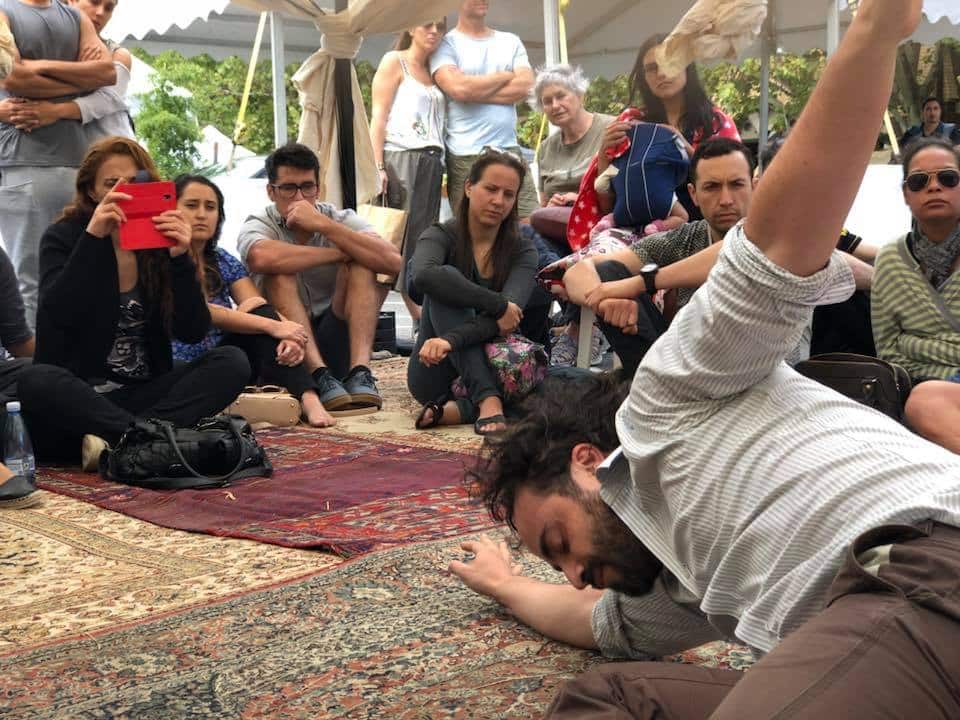 Audience members at a "Bukje" event highlighting the journey of refugees.