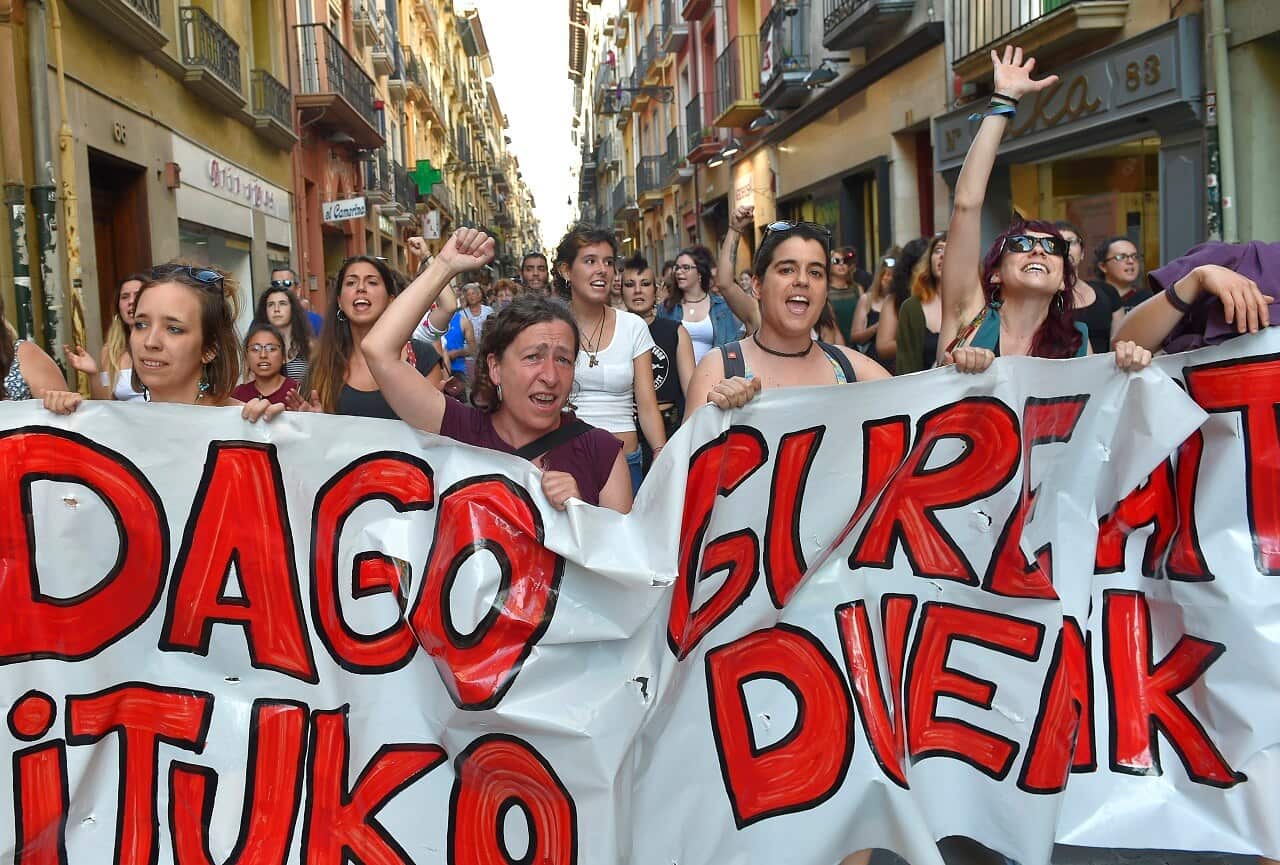 Protesters rally after a court ordered the release on bail of five men sentenced to nine years prison for sexually abusing a young woman in Spain.