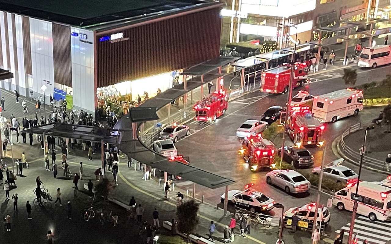 Emergency services at Kokuryo Station following a knife and fire attack on 31 October, 2021.