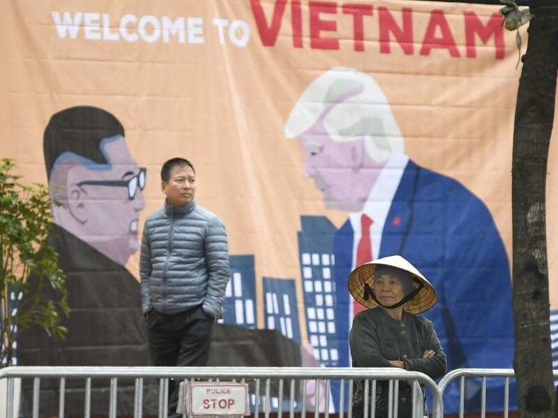 A banner with images of the US President and the North Korean leader