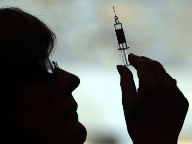 A nurse preparing to give a patient an injection