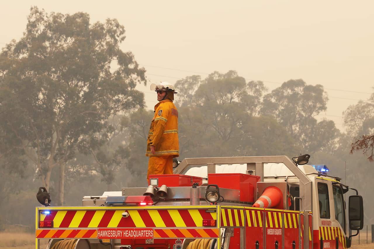NSW Rural Fire Service personnel prepare to tackle a bushfire at Gospers Mountainnear Putty, north-west of Sydney, Saturday, November 16, 2019. 