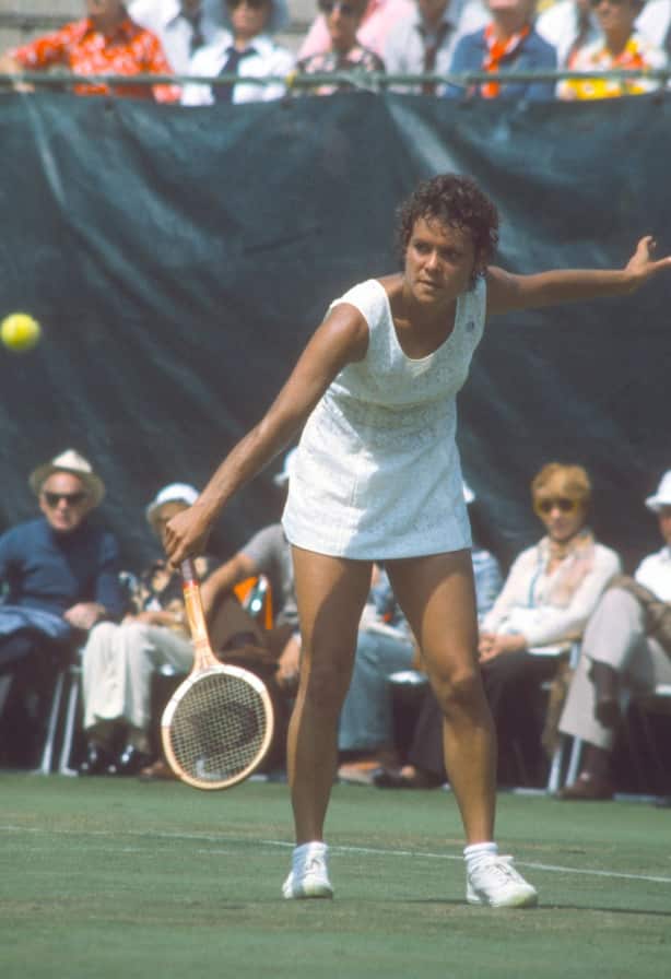 Evonne Goolagong of Australia returns a shot during a match at the Women's 1974 US Open Tennis Championships 