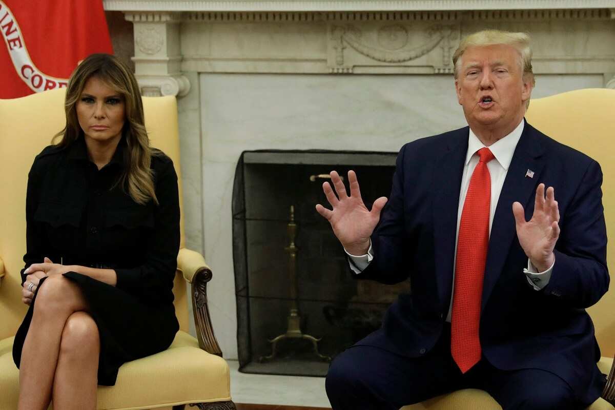 U.S. President Donald Trump talks to the media next to First Lady Melania Trump during a meeting about vaping in the the Oval Office at the White House.