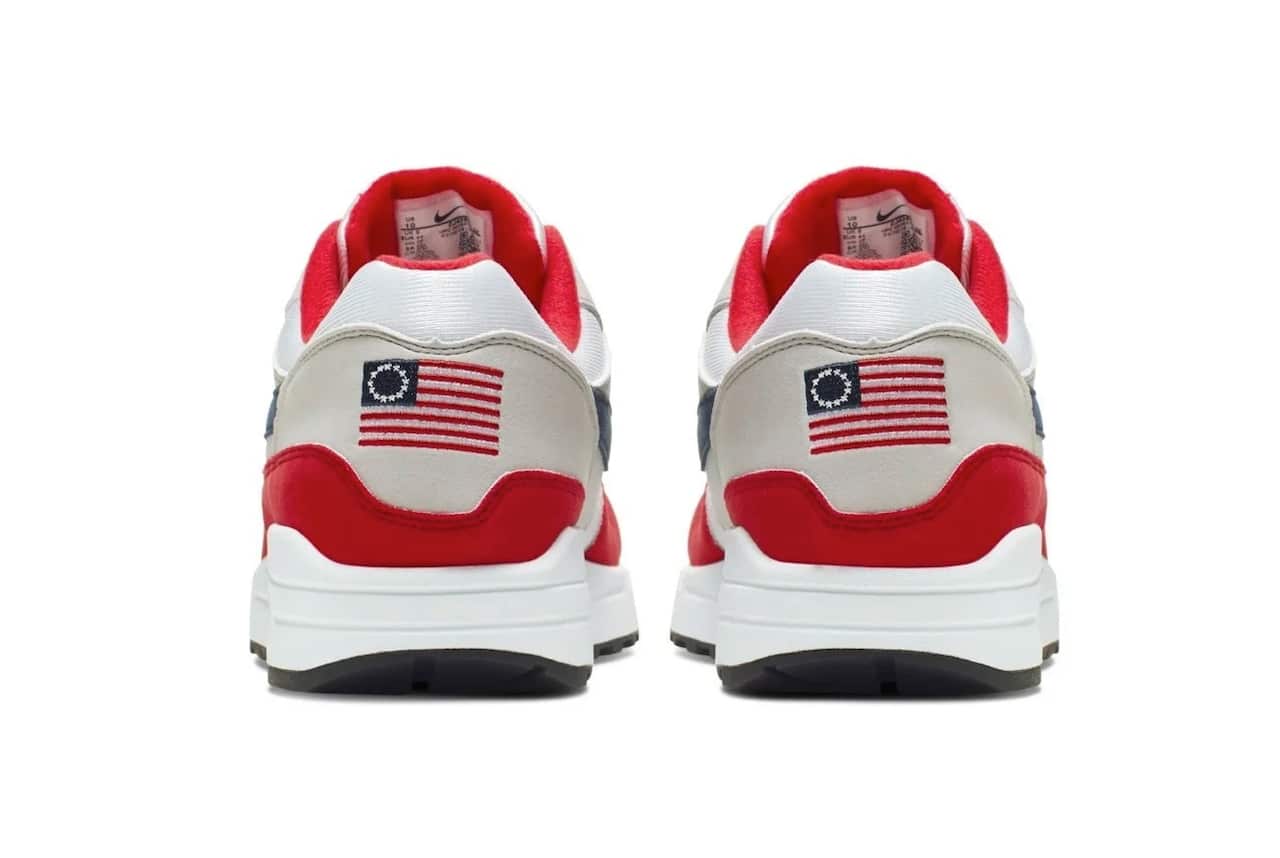 Nike Air Max 1 Quick Strike Fourth of July shoes that have a US flag with 13 white stars in a circle on it, known as the Betsy Ross flag.