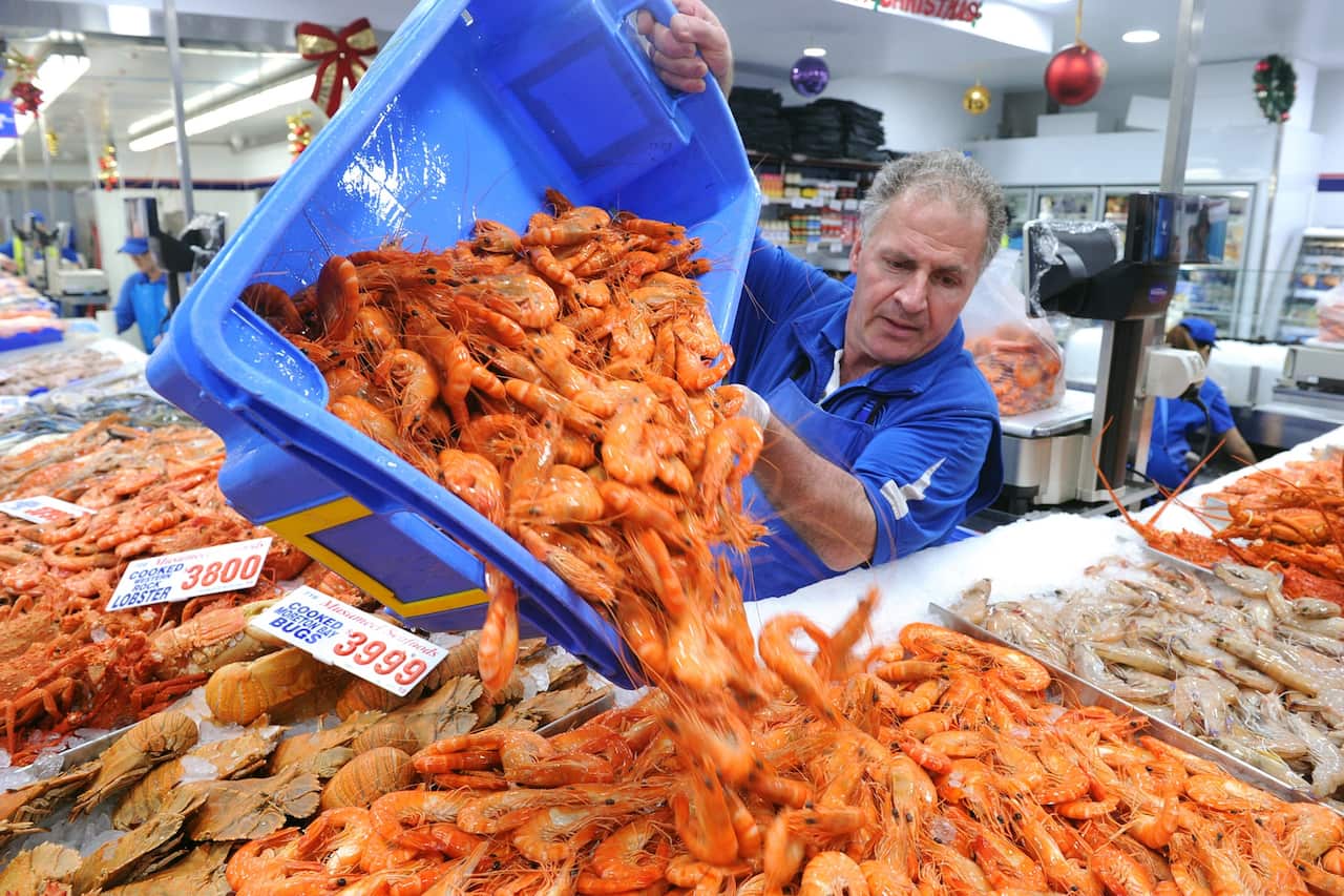 Workers restock prawns at the Sydney Fish Market