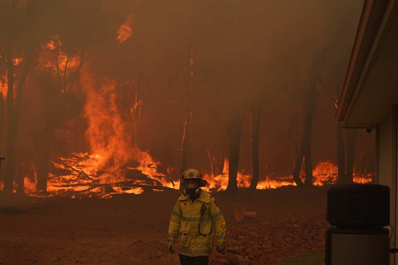 Firefighters battle a blaze in Brigadoon, Perth, on Tuesday, 2 February.