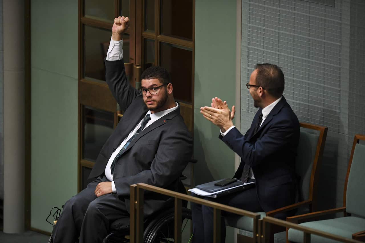 Jordon Steele-John celebrates the passing of the Disability Royal Commission motion in 2019.