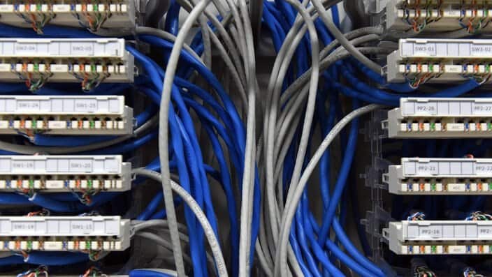 Ethernet data cables are seen in a server room in Canberra