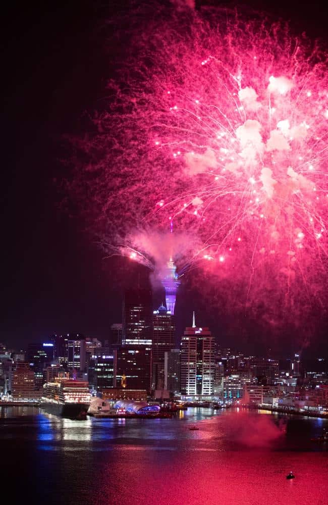 Fireworks are seen exploding from the Aucklands Waitemata Harbour and Sky Tower during the Auckland New Year's Eve celebrations.