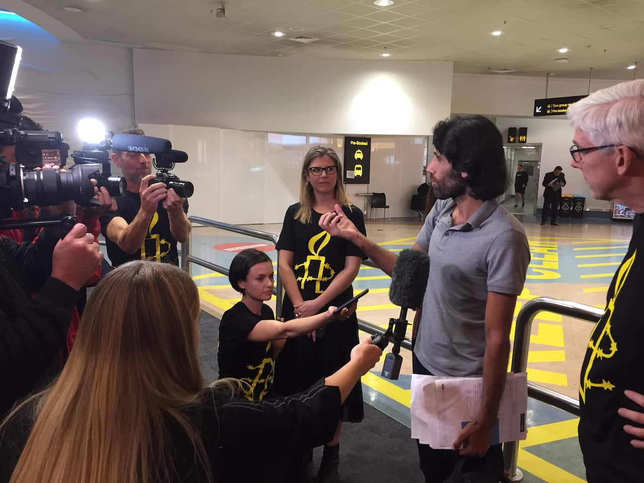 Behrouz Boochani speaks shortly after touching down in New Zealand. 