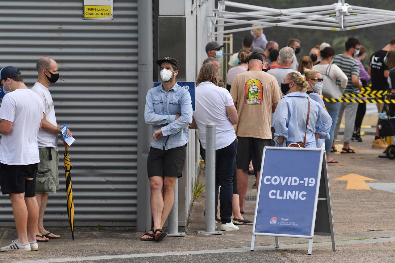 People line up for COVID-19 testing at Mona Vale Hospital's walk-in clinic in Sydney's Northern Beaches. 