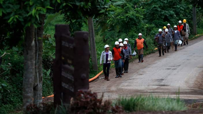 Rescue workers leave the cave site after the successful evacuation of all 12 boys and their coach.