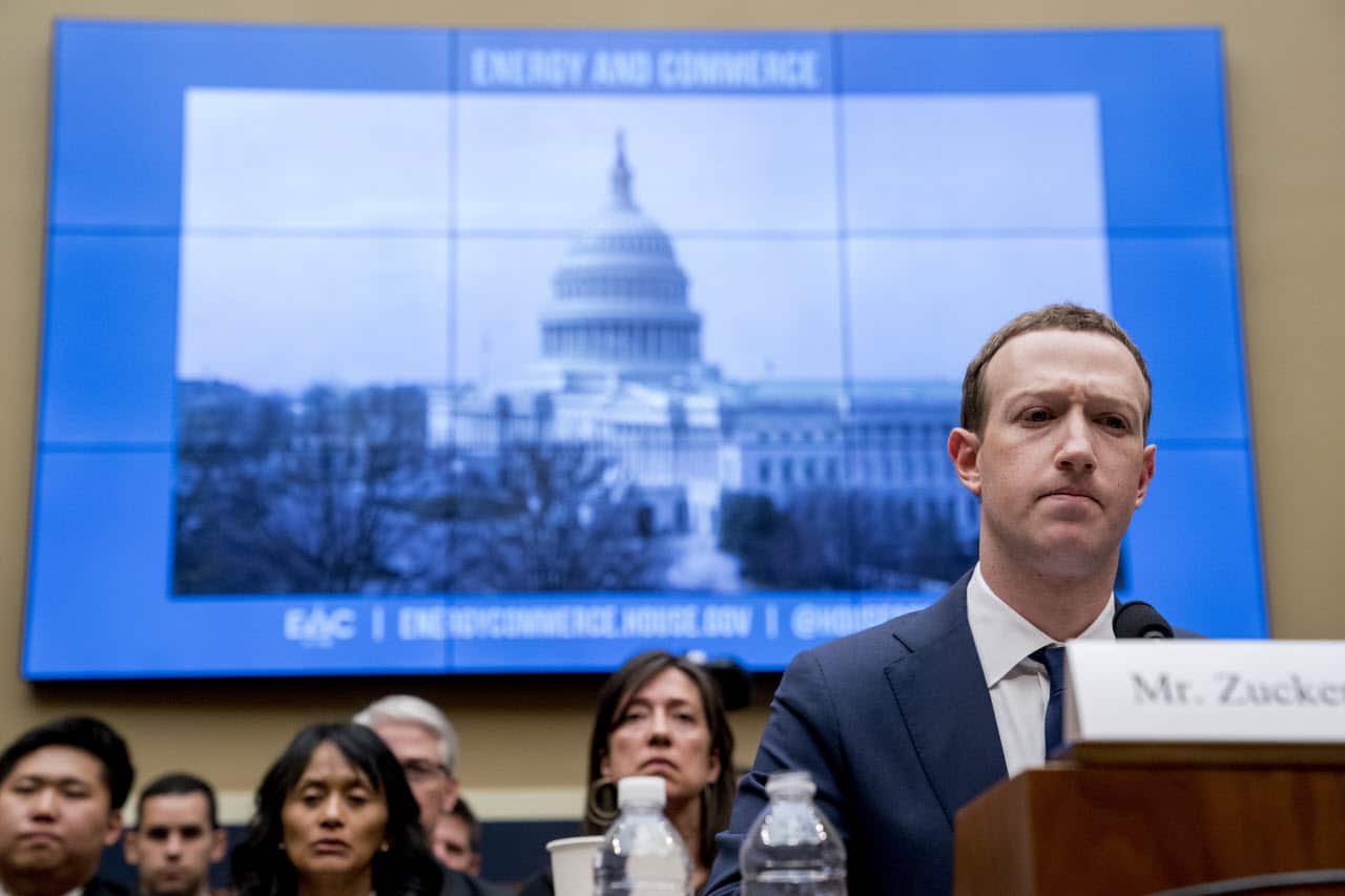 Facebook CEO Mark Zuckerberg pauses while testifying before a House Energy and Commerce hearing on Capitol Hill in Washington.