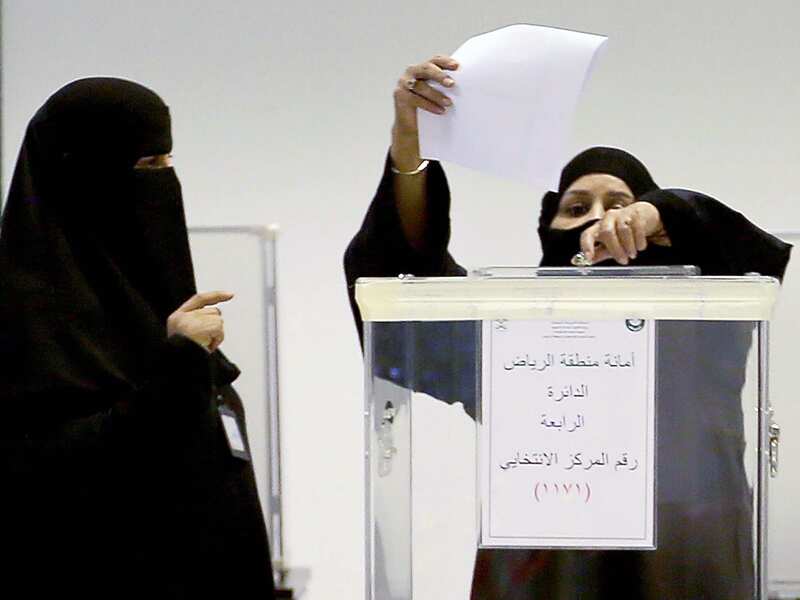 Saudi women cast their votes at a polling station