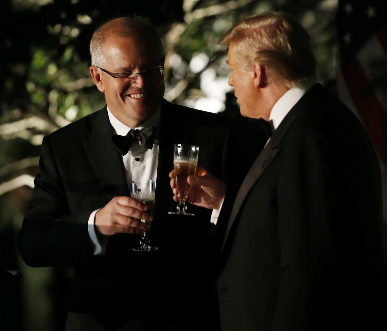 President Donald Trump and Prime Minister  Scott Morrison toast as they speak in the Rose Garden outside the White House.