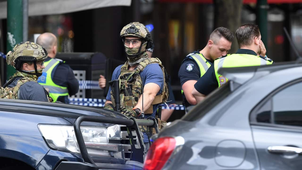 Police are seen at an incident on Bourke Street in Melbourne.