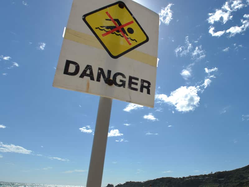 Warning sign near water
