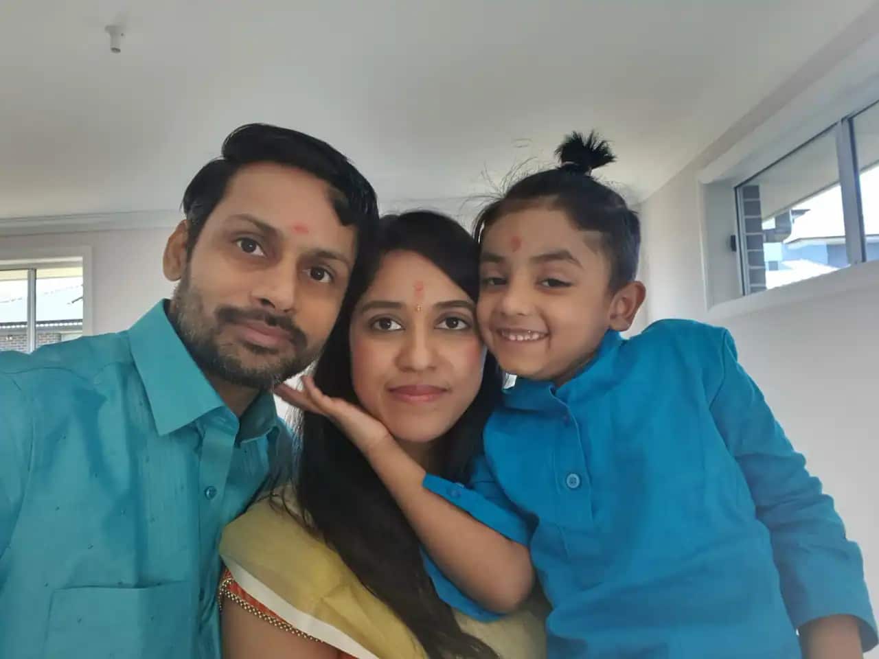 Sreenith Kulangarath with his wife Sandhya and six-year-old son Vedansh.
