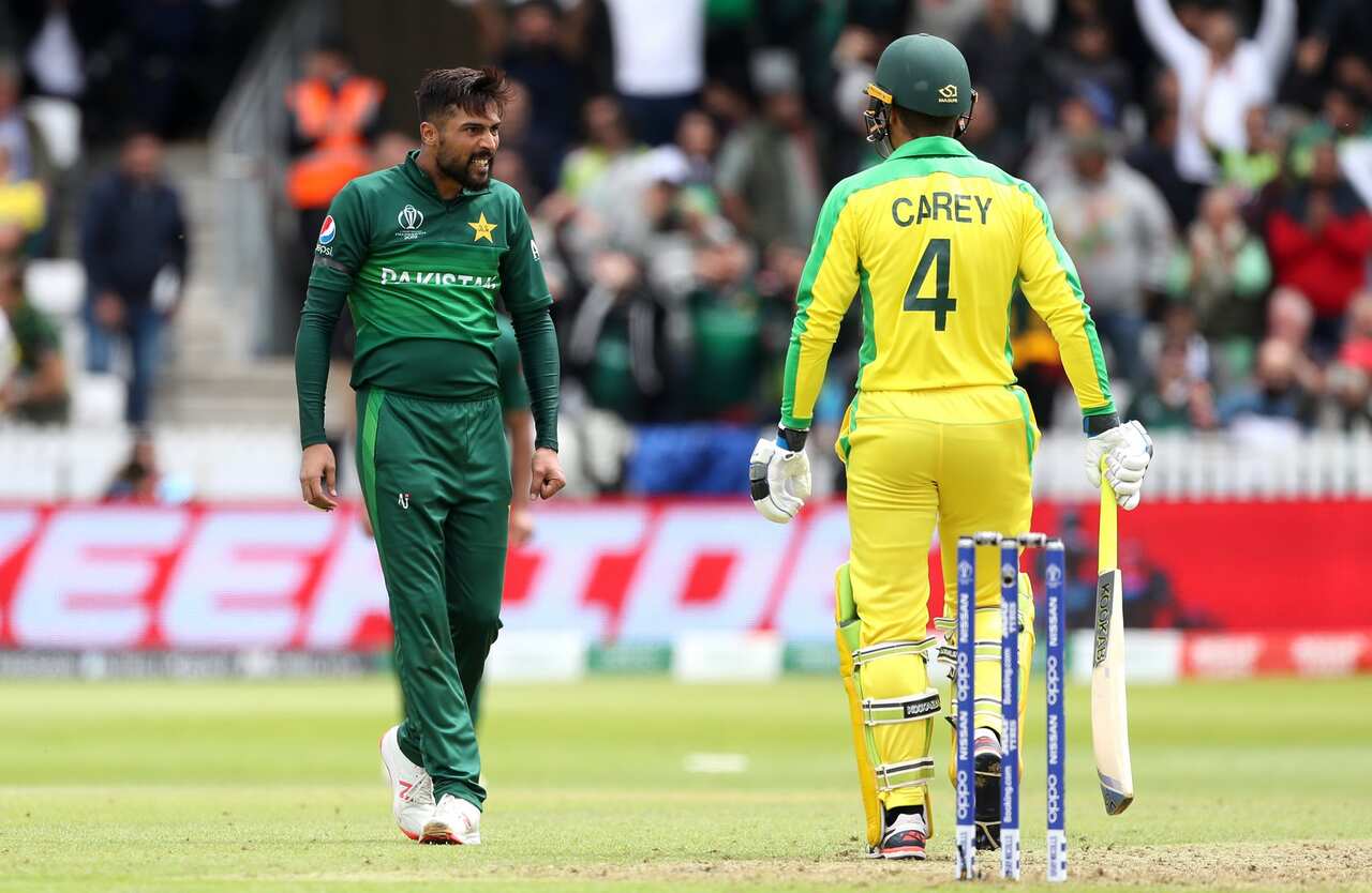 Pakistan's Mohammed Amir (left) and Australia's Alex Careys exchange words during ICC Cricket World Cup at County Ground Taunton. Image: David Davies/PA Wire. 