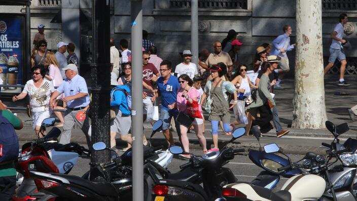 People flee the scene in Barcelona, Spain, after a white van ploughed into pedestrians in the historic Las Ramblas district