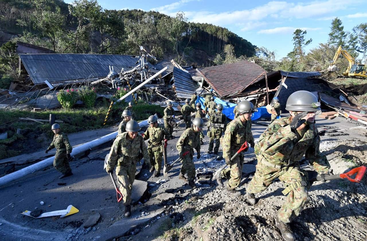 Self Defense Forces of Japan officers conduct a search at a collapsed house due to landslide in Atsuma Town, Hokkaido Prefecture on Sep.6, 2018