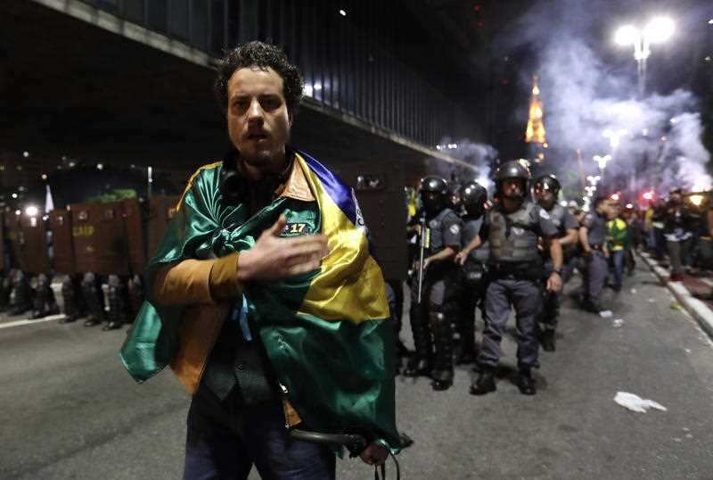 Supporters of Brazilian far-right presidential candidate Jair Bolsonaro celebrate his victory at the Paulista Avenue in Sao Paulo.