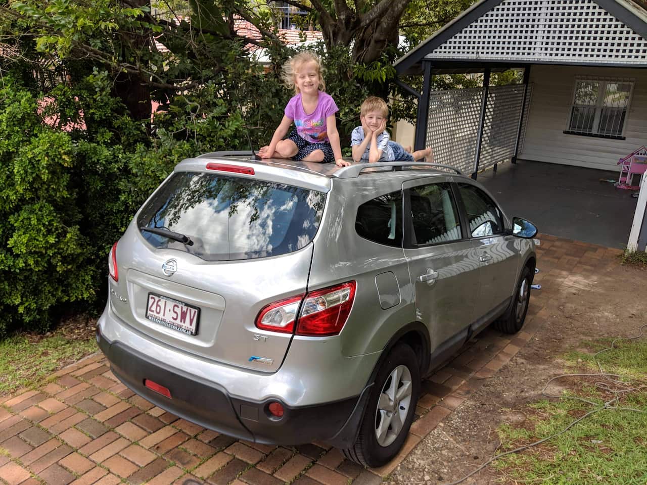 The De Lizio's children out side their Brisbane home in 2017