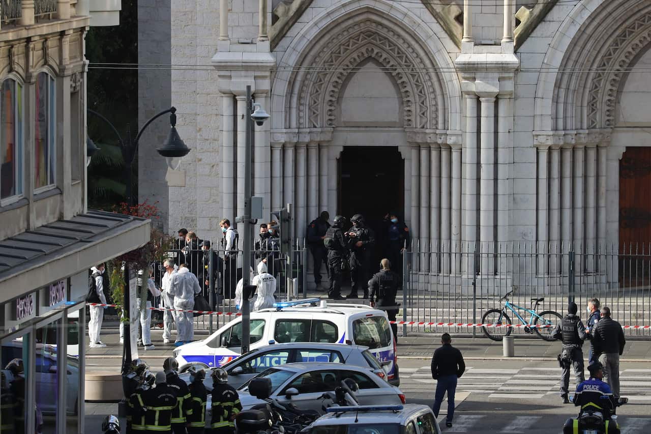 French members of the elite tactical police unit RAID enter to search the Basilica of Notre-Dame de Nice after the knife attack.