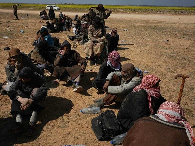 Men screened after being evacuated from Baghouz