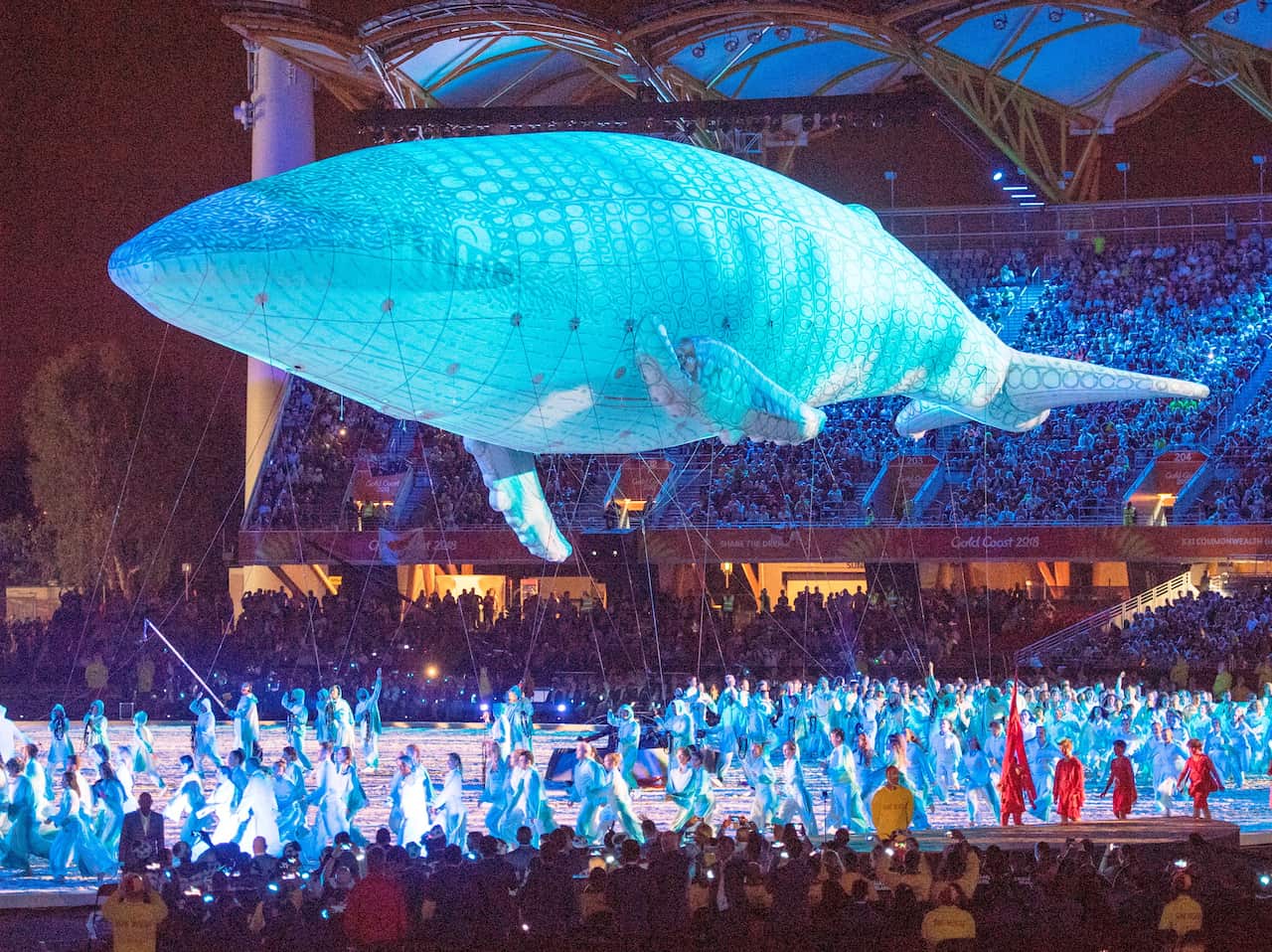 The White Whale, Migaloo, floats over performers during opening ceremonies for the Commonwealth Games Wednesday, April 4, 2018 in Gold Coast, Australia.T  (Ryan Remiorz/The Canadian Press via AP)