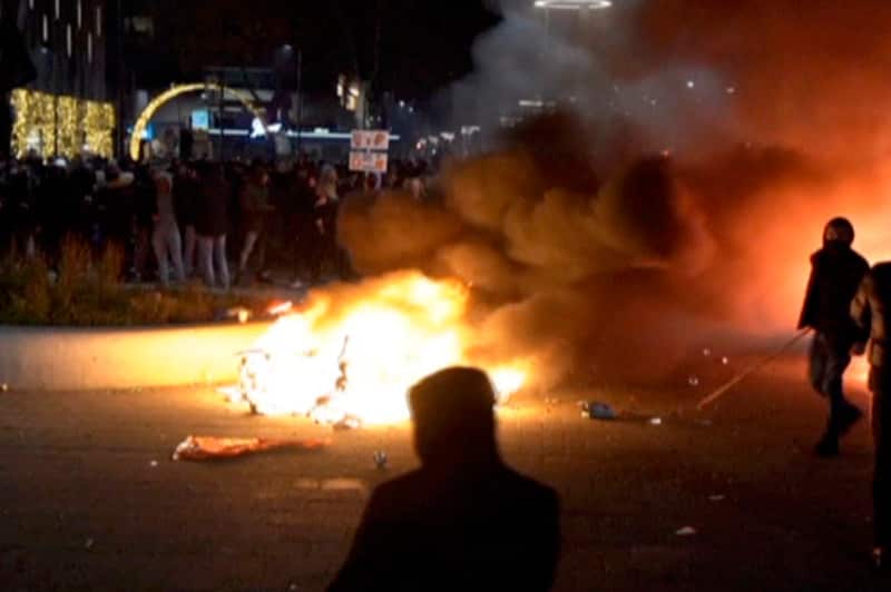 Demonstrators protest government restrictions due to the coronavirus pandemic in Rotterdam, Netherlands