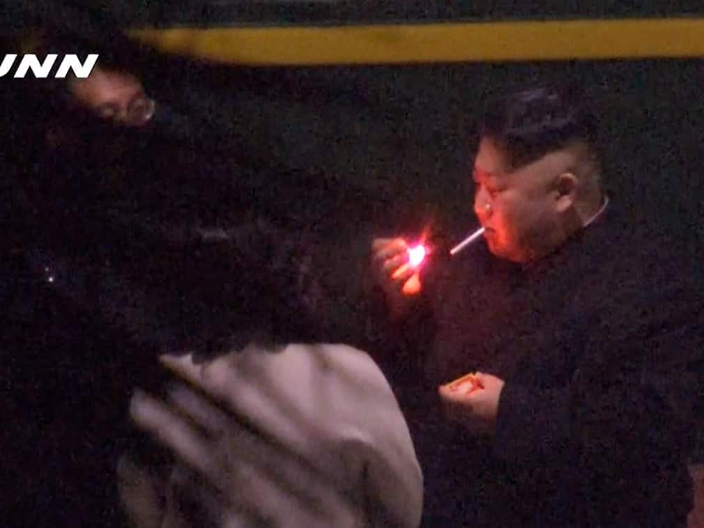 North Korean leader Kim Jong-un has been filmed taking a cigarette break during his marathontrain journey to Vietnam.