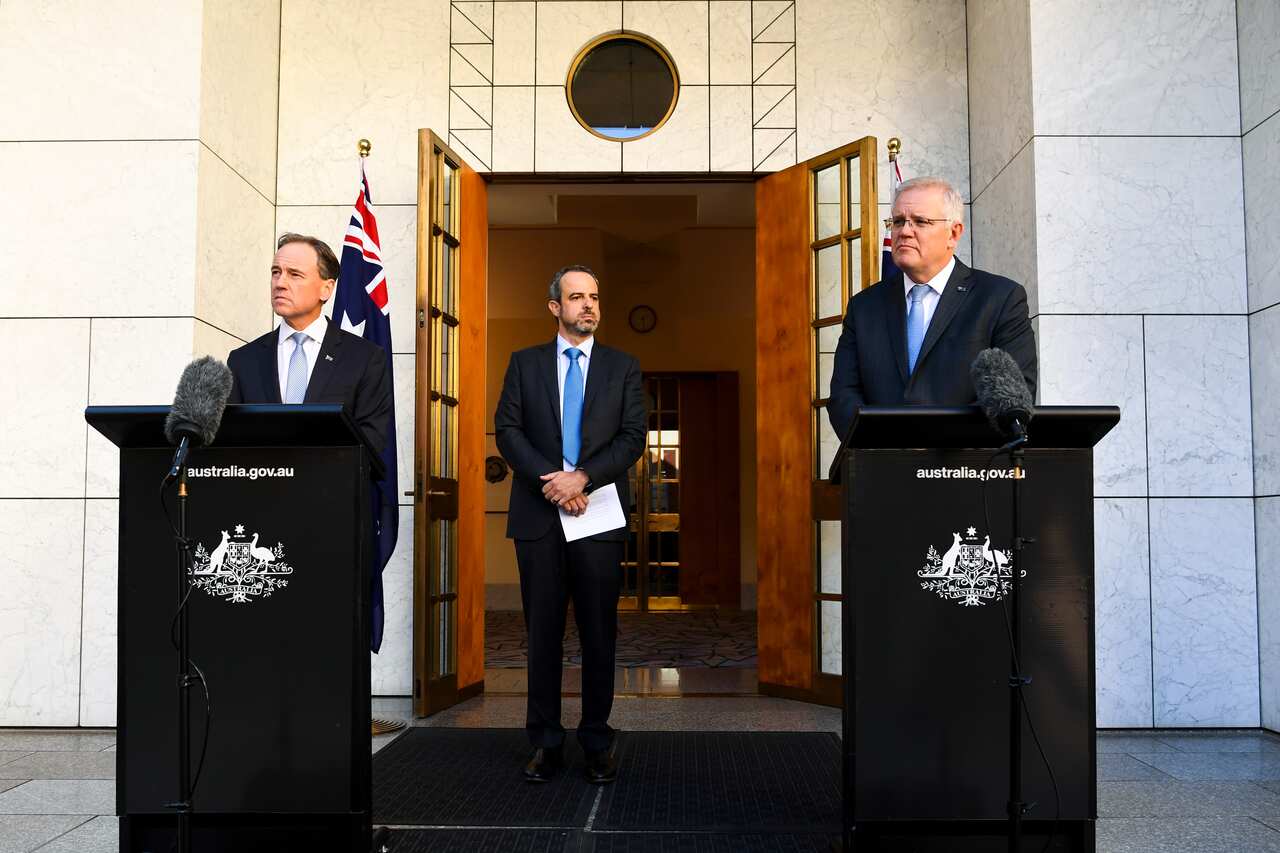 Health Minister Greg Hunt, Medical Association President Dr Omar Khorshid and Prime Minister Scott Morrison during a press conference in Canberra, 27 May, 2021.