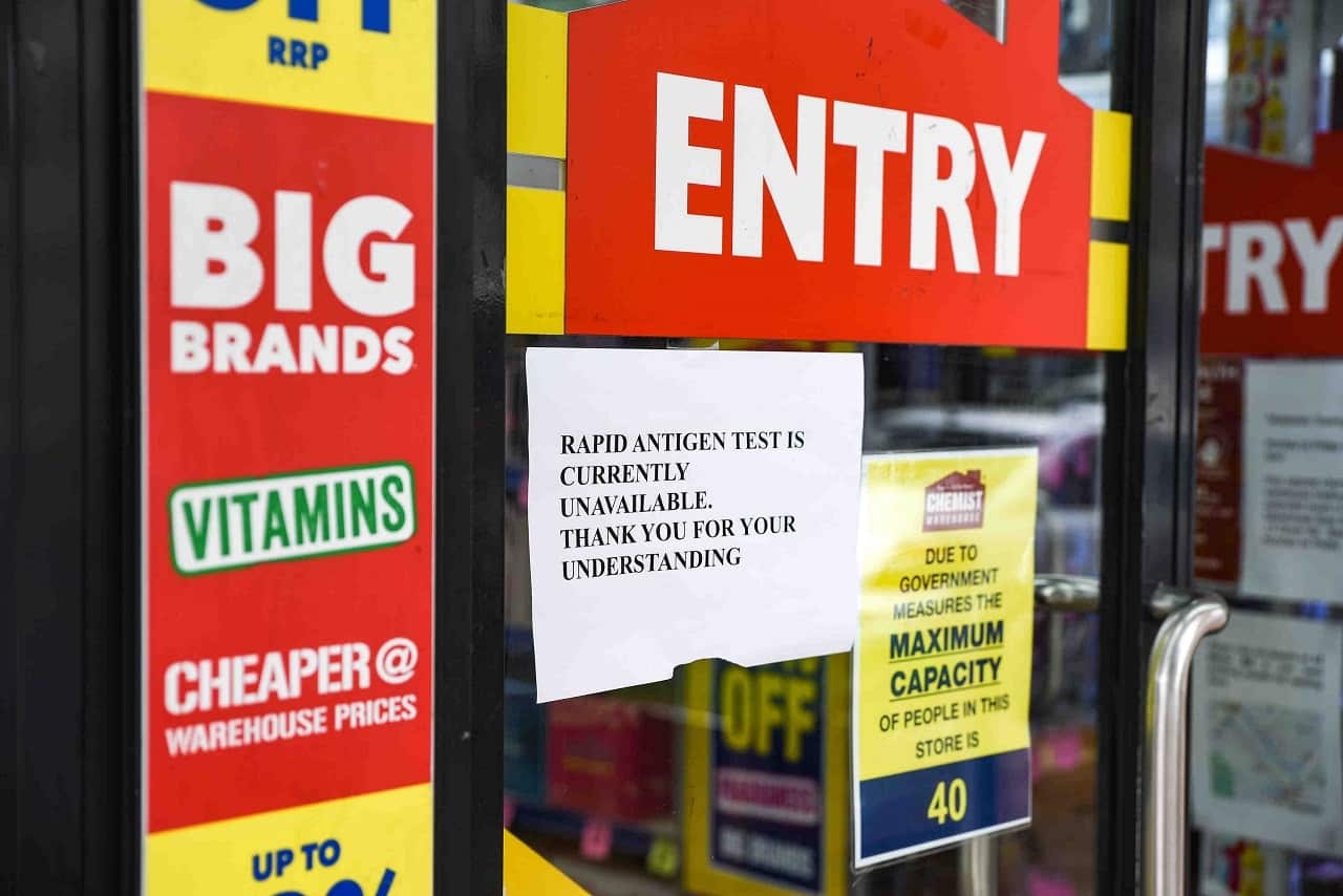 Signage notifying customers that Rapid Antigen Test (RAT) kits are sold out is seen on the entrance to a chemist in Sydney, Thursday, 