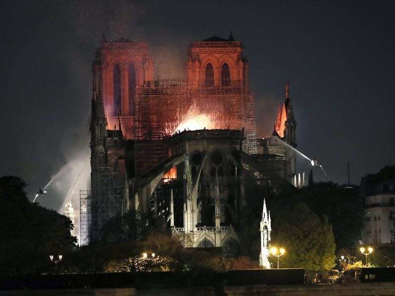 Firefighters battle the flames at the Cathedral